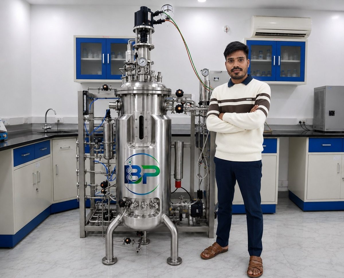 Bioprim Technologies in-situ scale fermenter with a team member for scale